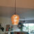 Replace recessed can lighting with pendant light.
