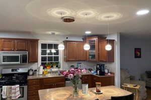 We were able to literally transform the look of the kitchen by adding some drama and sparkle as well as more purposeful lighting.
