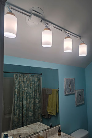 http://Track%20lighting%20over%20bathroom%20vanity.