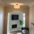 Semi flush mount light in hallway going into basement